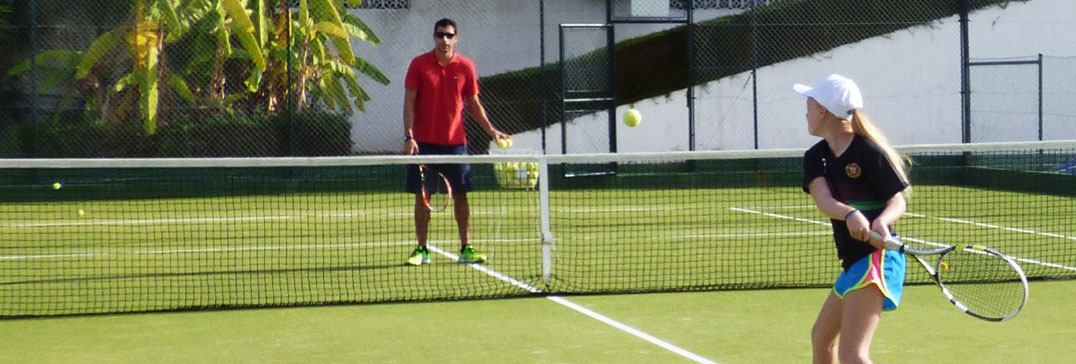 Child playing tennis, Algarve Family Holiday