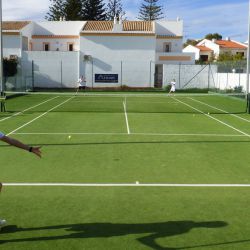 Doubles match on the Luz Bay Hotel courts