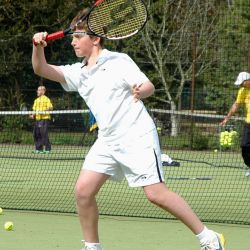 Teenage player hitting a forehand, at London Tennis Clinic