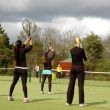 Adult tennis players at the London tennis camp