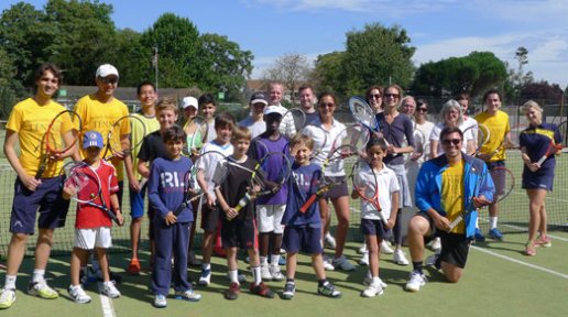 Children and adult players at the London Tennis Clinic