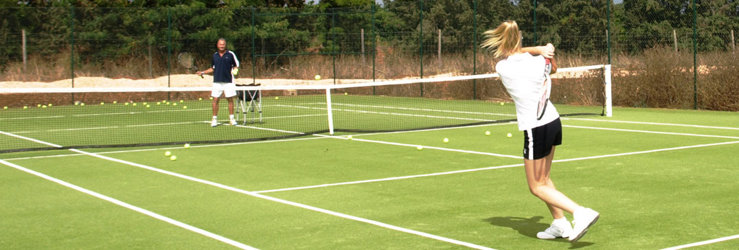 Tennis coaching on the astro turf, Algarve