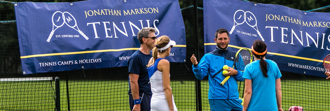 Tennis coach and his adult group