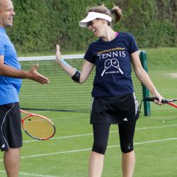 Adult tennis players enjoying grass court tennis