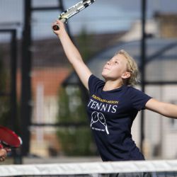 Girl reaching for tennis smash, Oxford Tennis Camp