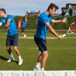 Tennis coach on court